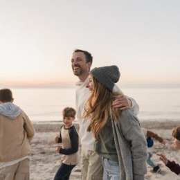 a family walking along a beach