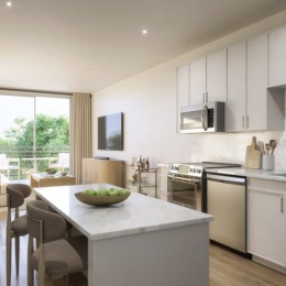 kitchen with ample counter-space, modern appliances and bright lighting